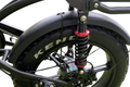 Close-up of dual rear suspension on electric bike, designed for extra comfort and stability on rough terrain and off-road rides.