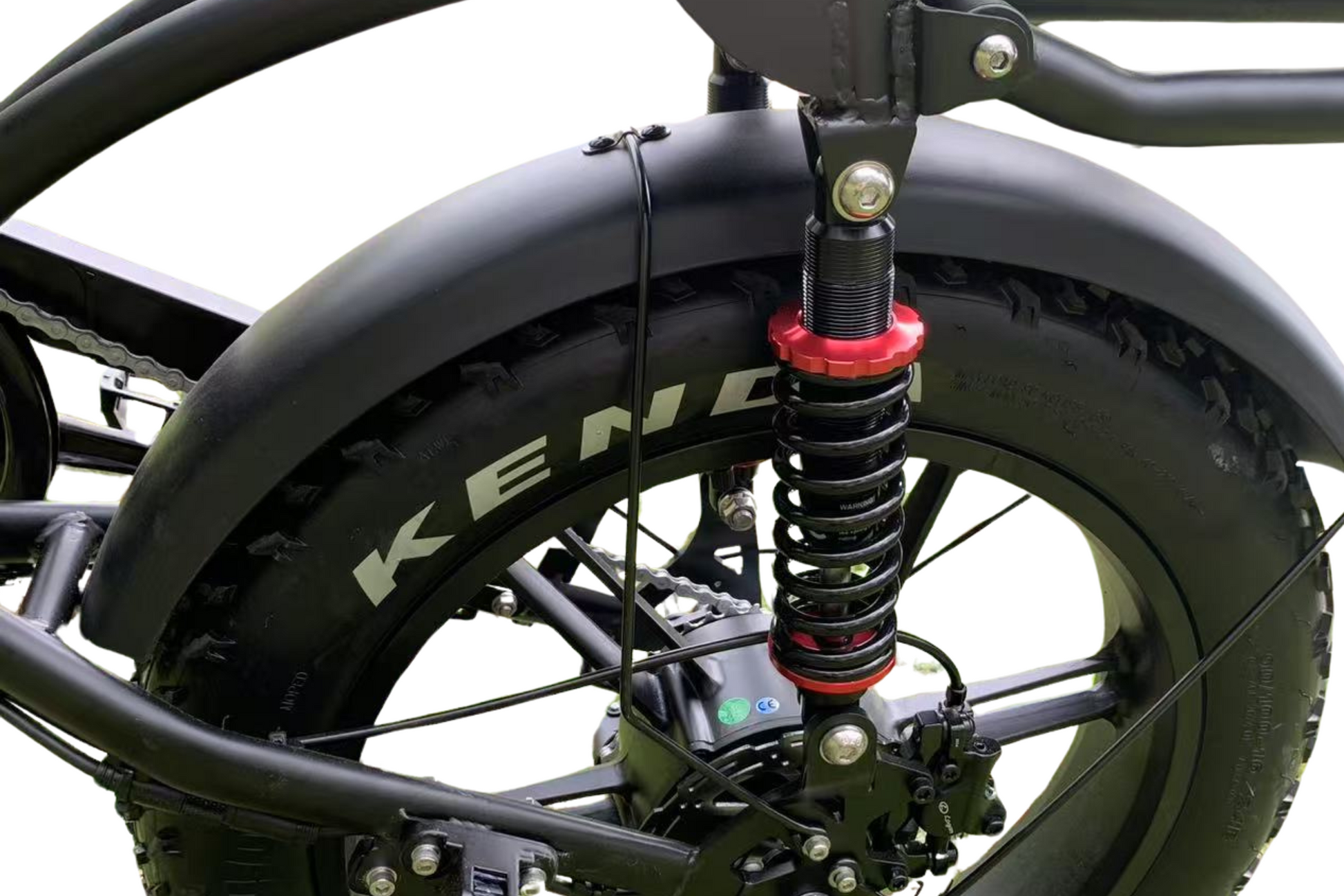 Close-up of dual rear suspension on electric bike, designed for extra comfort and stability on rough terrain and off-road rides.