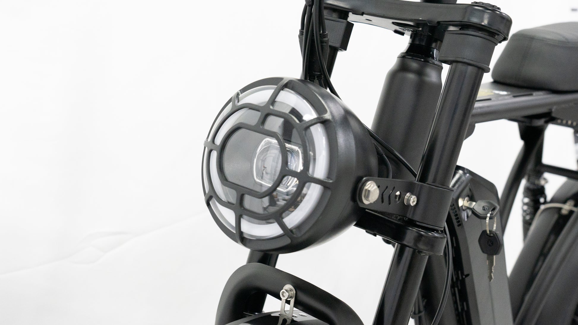 Close-up of the E-Bike’s integrated LED light, enhancing safety and visibility for night rides with its bright, energy-efficient design.
