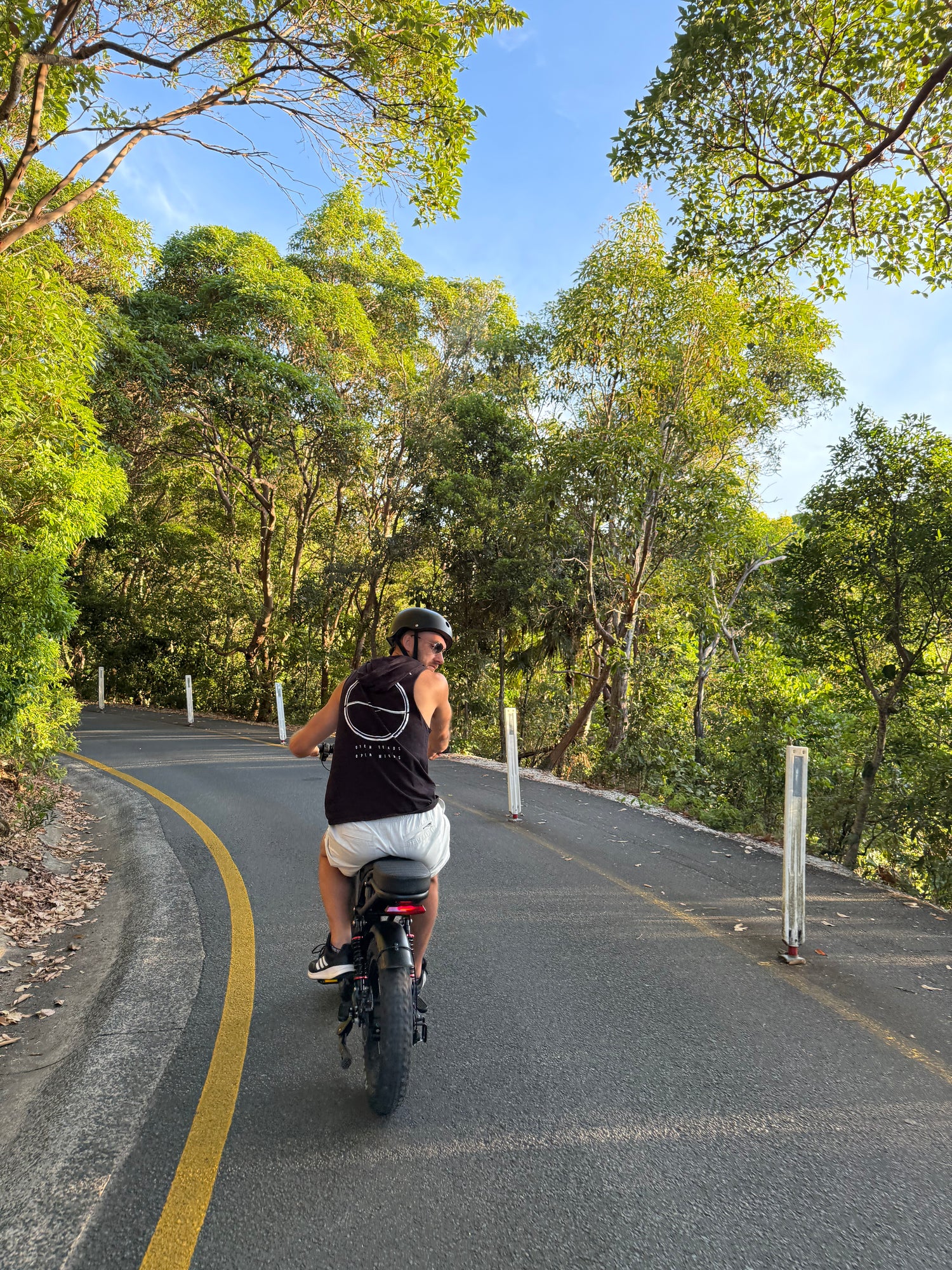 Man riding a fat tyre electric bike on a forest road in Australia