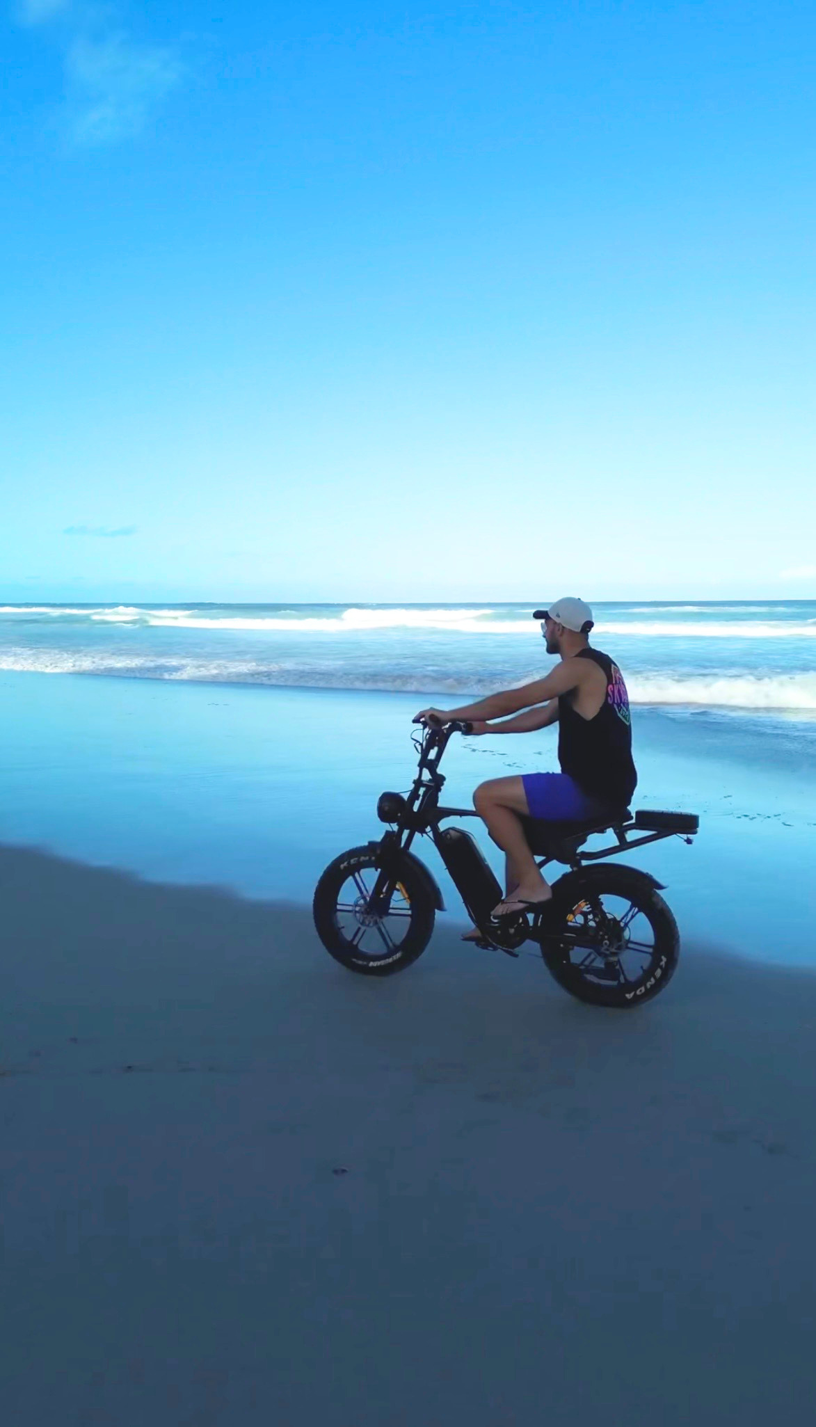 Fat tyre eBike riding on sand at an Australian beach