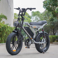 Detail shot of a brushless electric motor on a fat tyre e-bike in gray, engineered for efficiency and power.