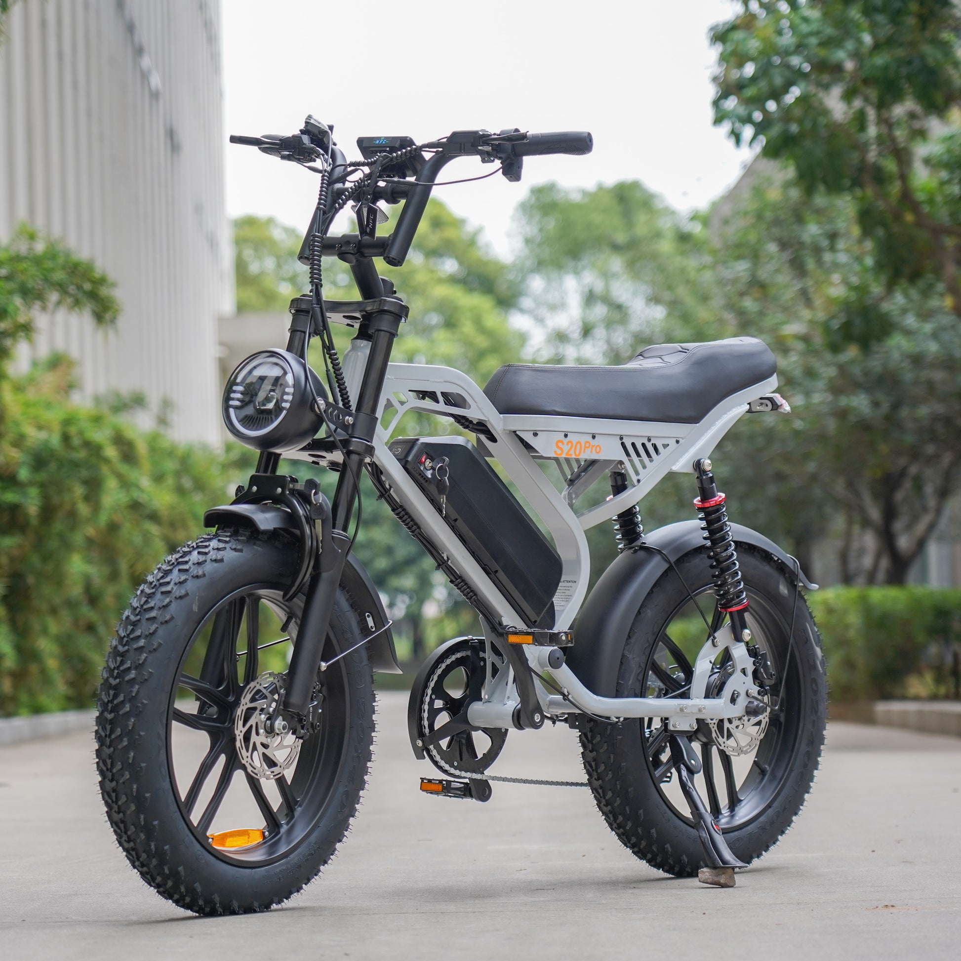 Detail shot of a brushless electric motor on a fat tyre e-bike in gray, engineered for efficiency and power.